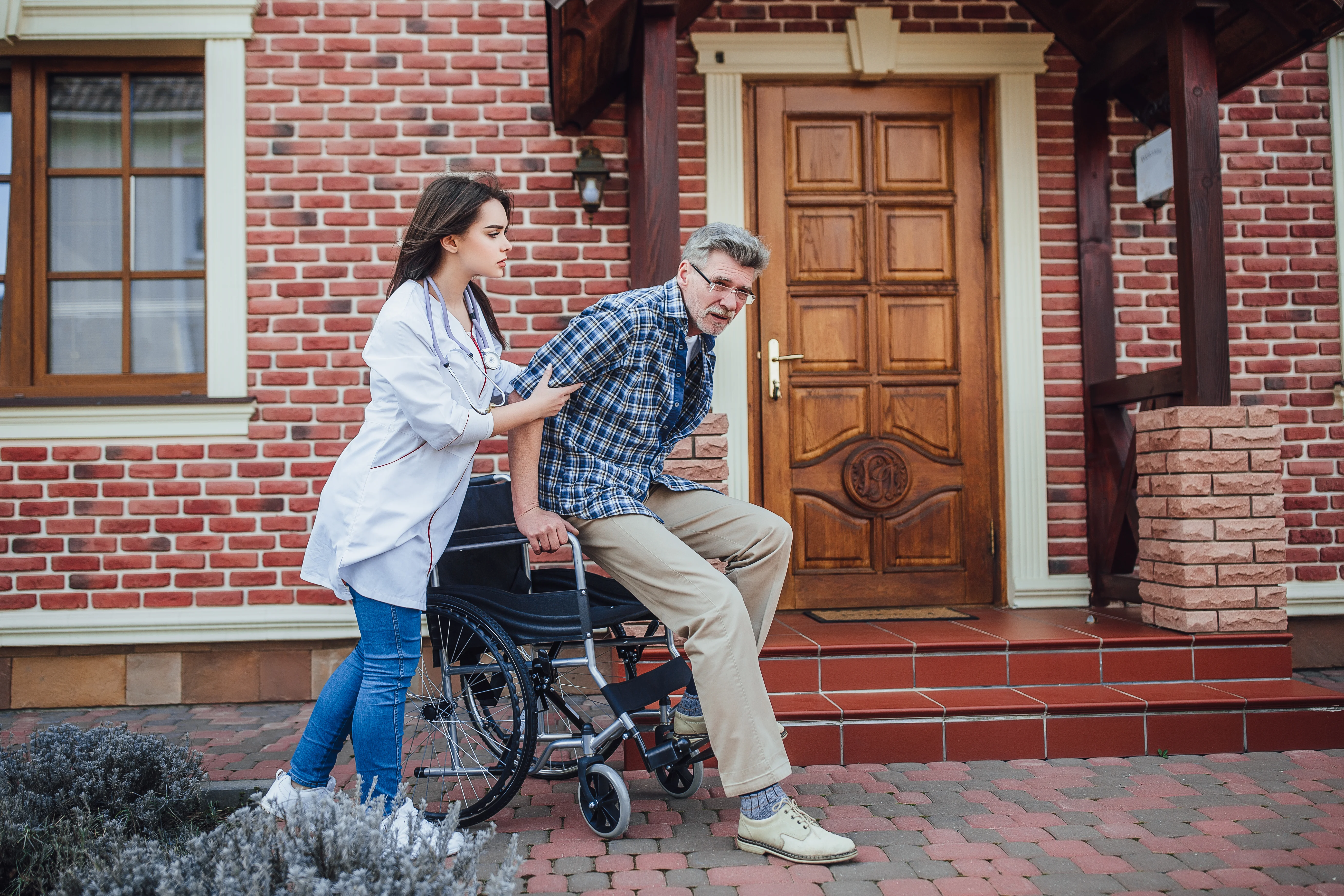 Nurse assessing patient mobility and fall risk