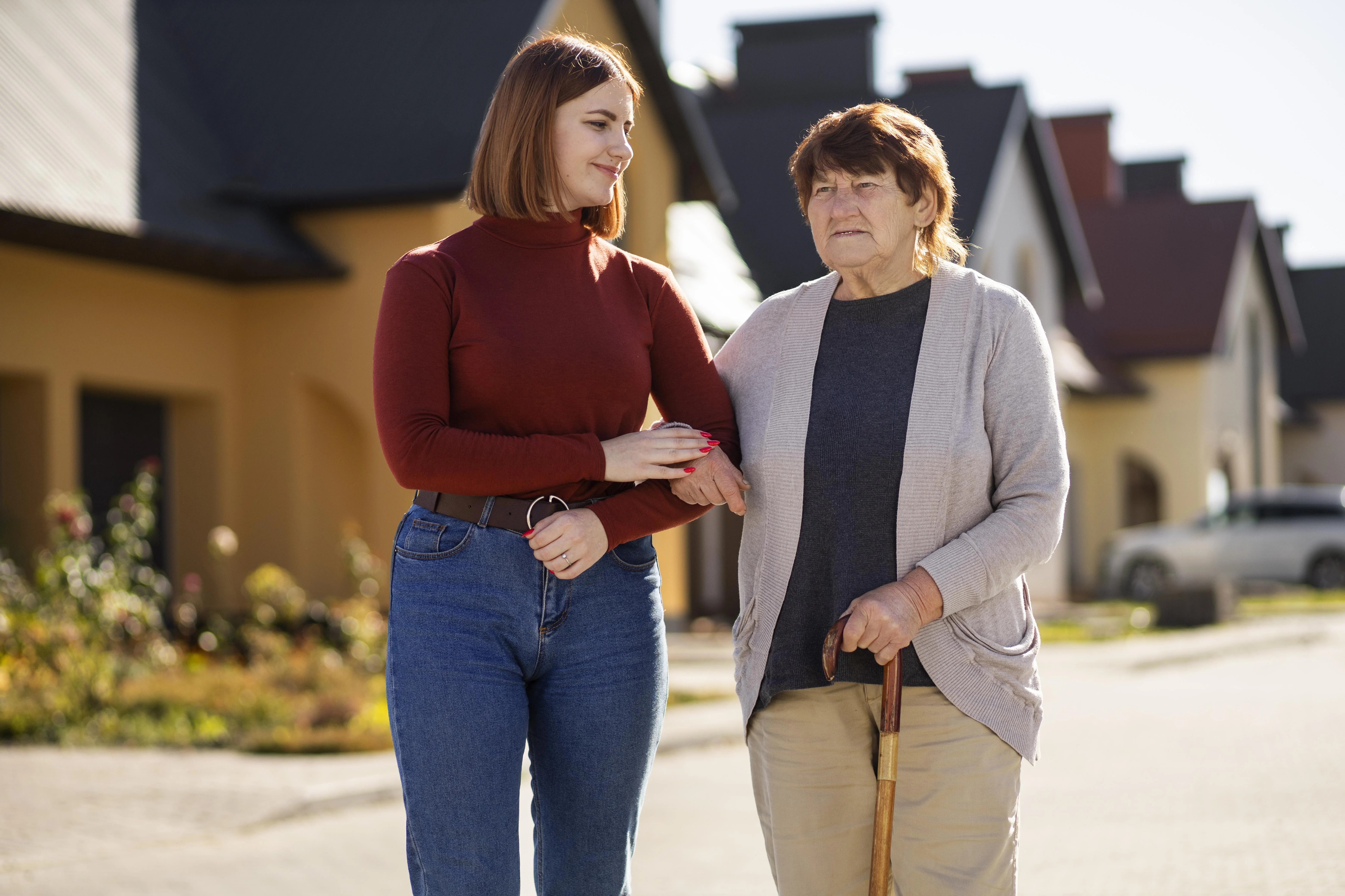 Care worker helping patient settle at home